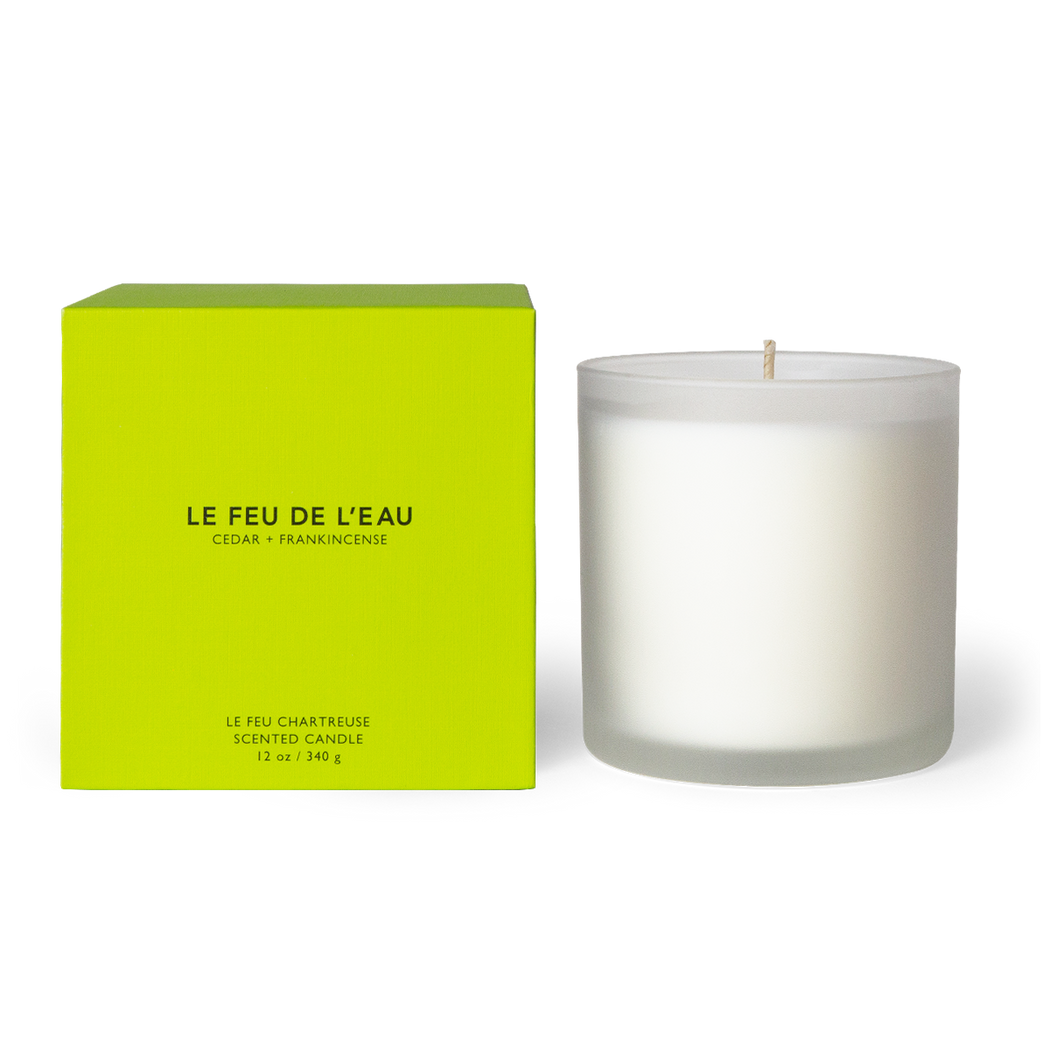  Discover the 12oz Chartreuse candle, blending cedar, sandalwood, and frankincense in Apricot and Coconut wax. With lead-free cotton wicks and a burn time of 65 hours, each candle brings a touch of artisanal luxury. Made in Los Angeles by LE FEU DE L'EAU and packaged in unique linen-textured paper. The candle is displayed unboxed, positioned beside its packaging, set against a clean white backdrop.