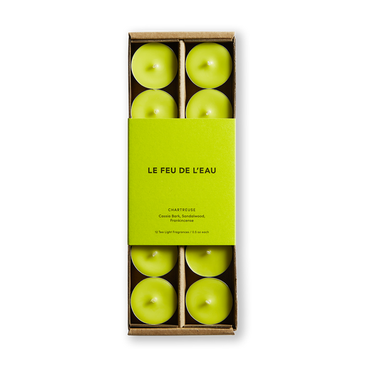 Elevate your ambiance with chartreuse scented tea light candles by Le Feu De L'eau. Infused with Cassia Bark, Sandalwood, and Frankincense, these hand-poured scents offer moments of mystical transition and delight. Made in LA. No phthalates, parabens or preservatives. Natural fragrance. Image is of lime green colored tea lights in matching colored lime green packaging.