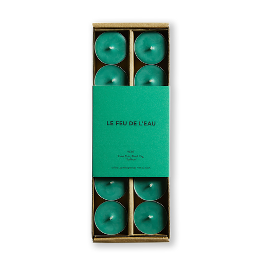Embark on a sensory journey with Le Feu de L'eau Vert scented tea light candles. Experience the tang of lime, the depth of black fig, and the allure of saffron. Set of 12, cruelty-free, coconut apricot wax, and natural fragrance tea light candles. Paraben-free. Clean burn, lead-free wicks. Image of green colored tea light candles in box with matching green packaging.